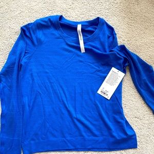 Brand new with tags Lululemon blue long sleeve Breeze top- size 12